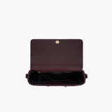 Borsa tracolla in similpelle bordeaux decorata con borchie oro La Carrie