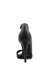 Tronchetto asimmetrico nero tacco stiletto Tsakiris Mallas